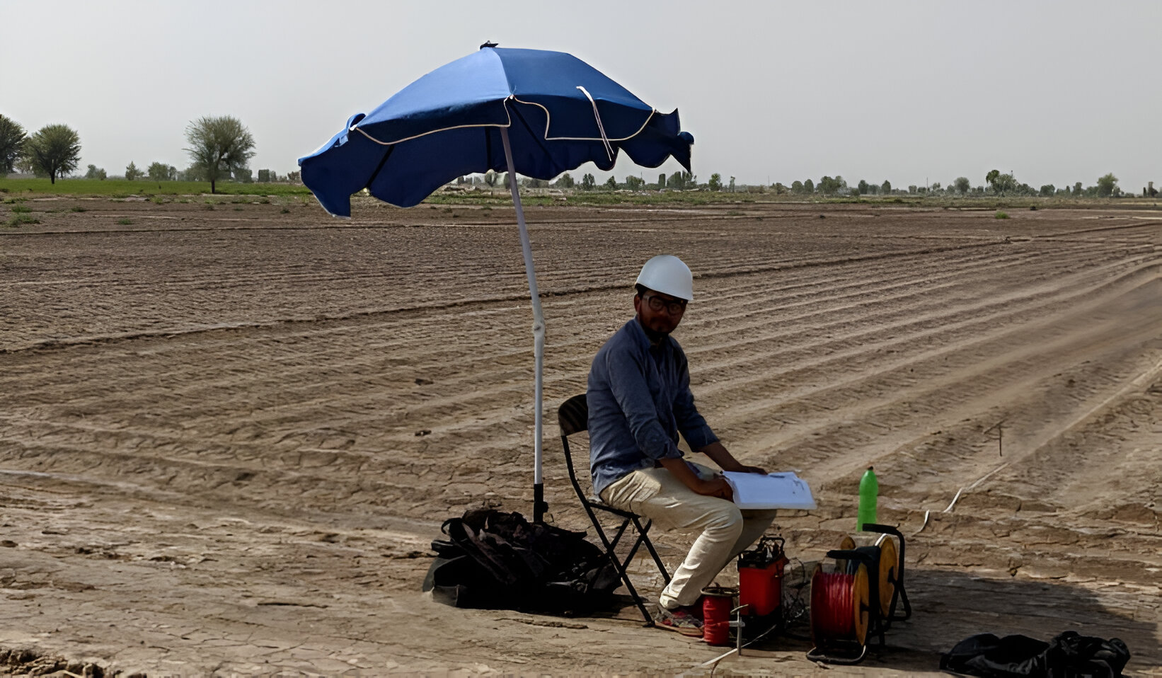 An image of a logging survey team overseeing water drilling operations